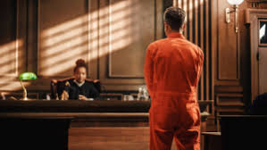 A criminal defendant standing before a judge in San Antonio, Texas. Criminal Defense Lawyer.